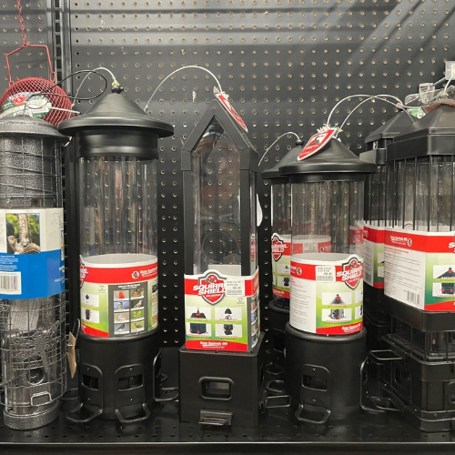 Display of wild bird feed and supplies, including squirrel shield bird feeders, at Mechanicsburg Agway.