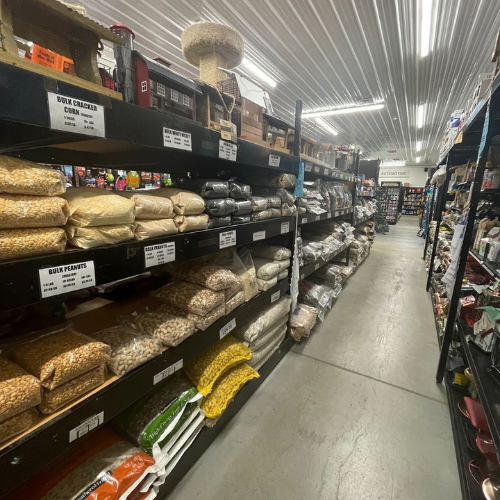 Display of wild bird feed and supplies, including bulk peanuts, cracked corn, and more, at Mechanicsburg Agway.